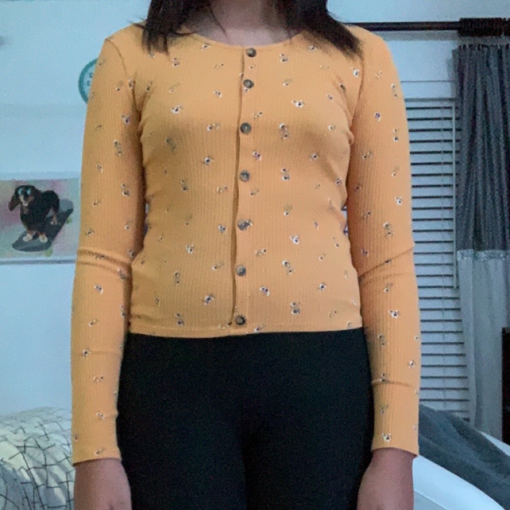 yellow button down shirt